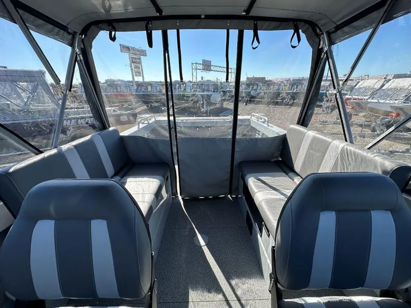 Slide: The Image of Interior of 2025 Hewescraft 200 ProV ET boat with seating and panoramic windows. - 7