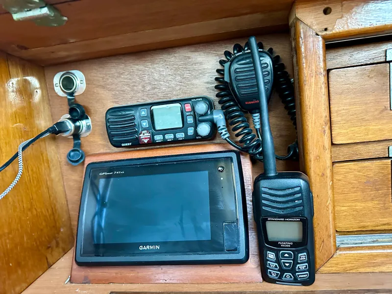 Slide: The Image of Navigation equipment on a 1970 Hinckley 38, featuring Garmin GPS and communication devices. - 24