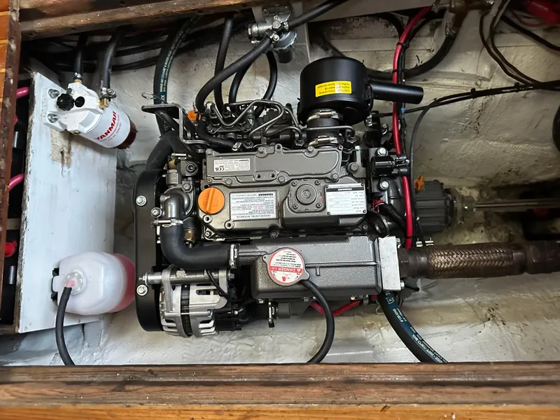 Slide: The Image of Engine compartment of a 1970 Hinckley 38 boat, showcasing detailed mechanical components. - 7