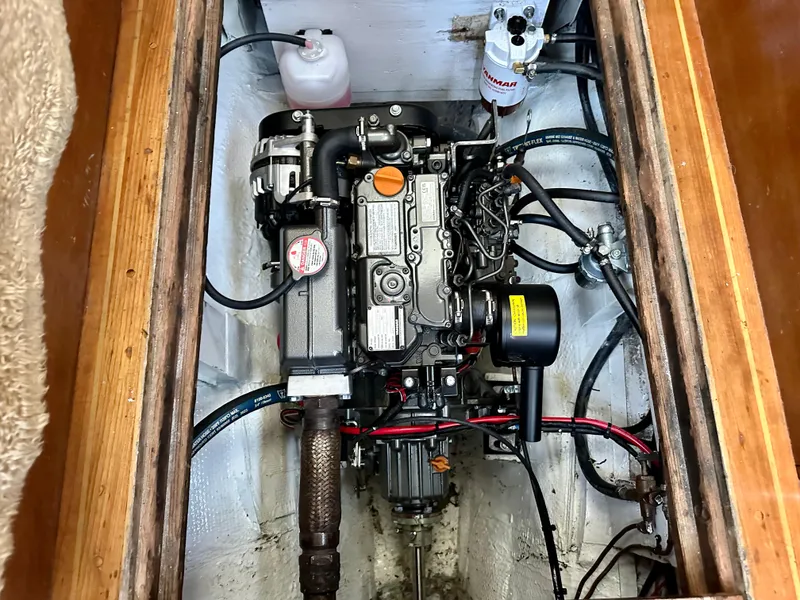 Slide: The Image of Engine compartment of a 1970 Hinckley 38 sailboat, showcasing detailed mechanical components. - 8