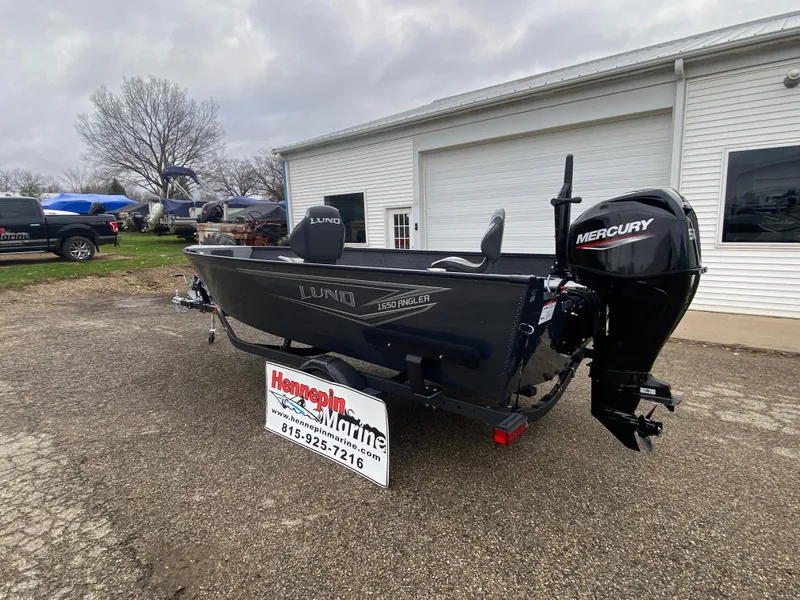Slide: The Image of 2025 Lund 1650 Angler Tiller boat with Mercury engine at dealership. - 1