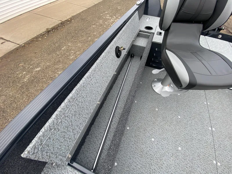 Slide: The Image of 2025 Lund 1650 Angler Tiller boat interior with seating and storage. - 15