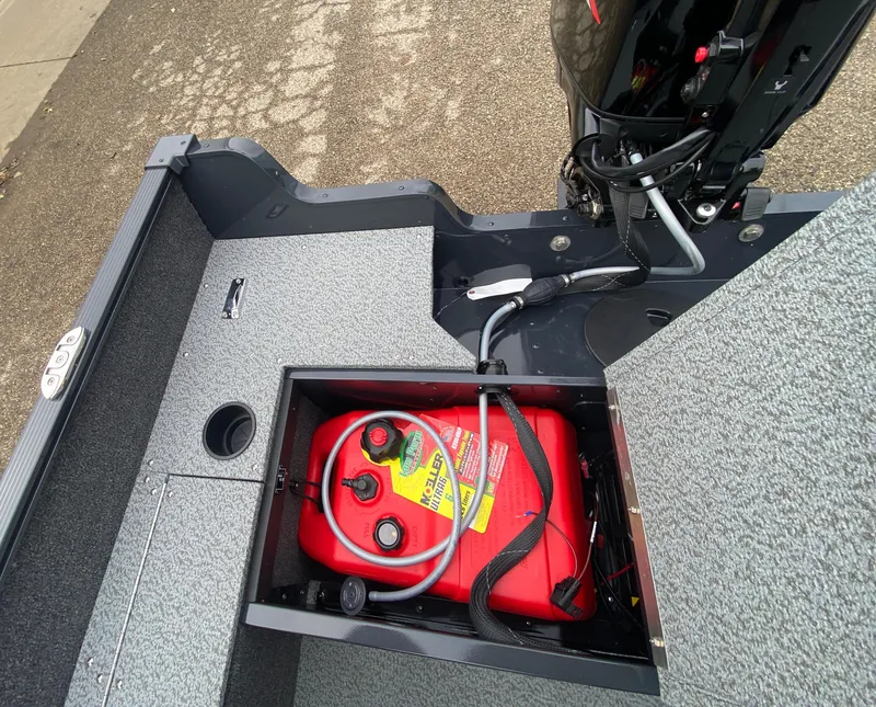 Slide: The Image of 2025 Lund 1650 Angler Tiller boat with open fuel compartment. - 25