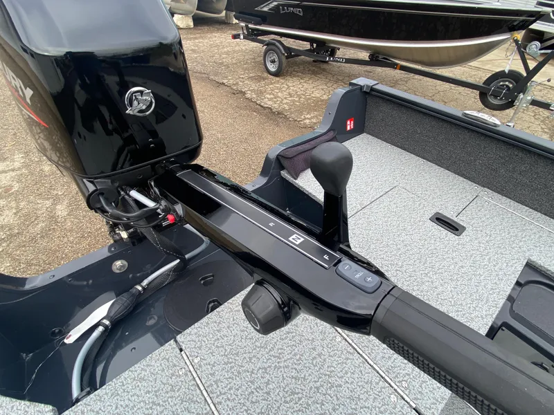 Slide: The Image of 2025 Lund 1650 Angler Tiller boat with Mercury outboard motor, interior view. - 27