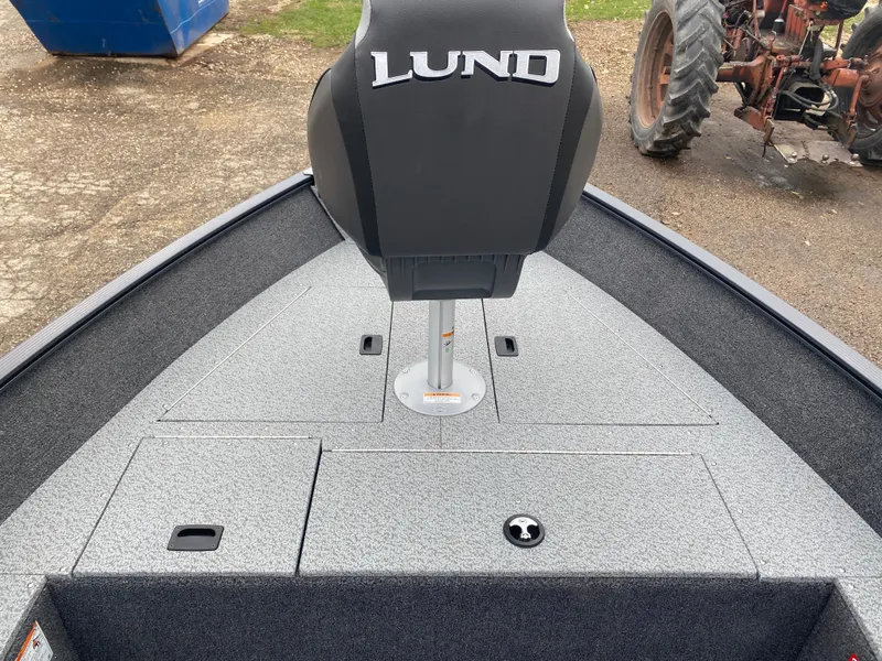 Slide: The Image of 2025 Lund 1650 Angler Tiller boat interior with seat and storage compartments. - 8