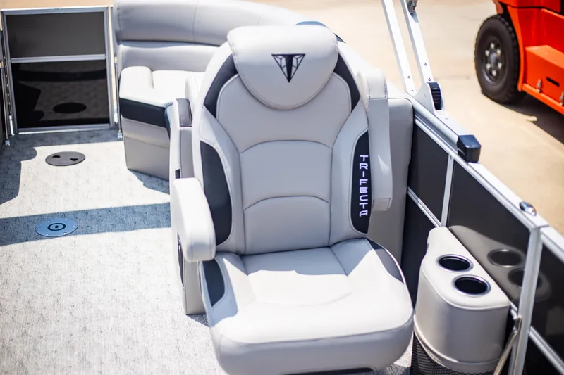 Slide: The Image of 2025 Trifecta 22RF LE2.75 boat interior with luxurious seating and cup holders. - 10