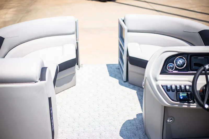 Slide: The Image of 2025 Trifecta 22RF LE2.75 pontoon boat interior with modern seating and dashboard. - 11