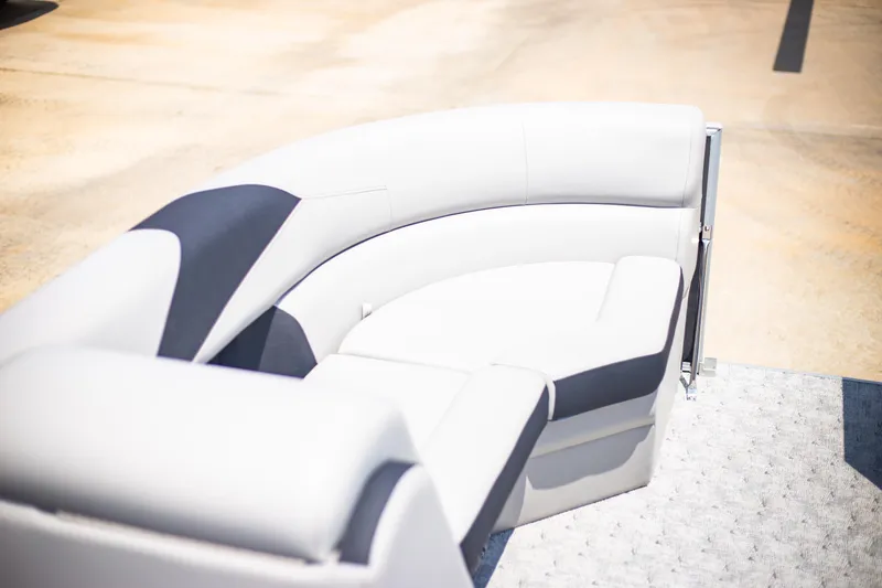 Slide: The Image of 2025 Trifecta 22RF LE2.75 boat seating, white and gray upholstery, outdoor setting. - 12