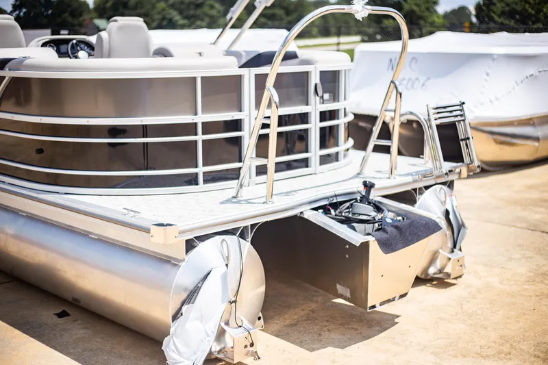 Slide: The Image of 2025 Trifecta 22RF LE2.75 pontoon boat, silver exterior, docked on sunny day. - 14