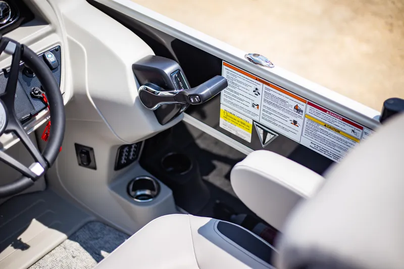 Slide: The Image of 2025 Trifecta 22RF LE2.75 boat interior with steering wheel and control panel. - 6