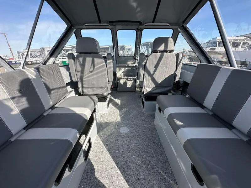Slide: The Image of Interior of 2025 Hewescraft 210 Sea Runner ET, featuring spacious seating and modern design. - 5