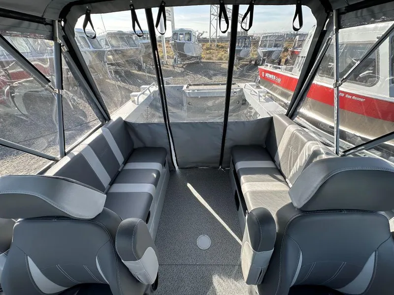 Slide: The Image of Interior of 2025 Hewescraft 210 Sea Runner ET with gray seating and spacious layout. - 6