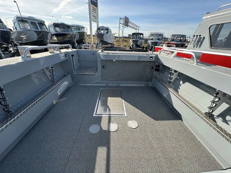 Slide: The Image of 2025 Hewescraft 210 Sea Runner ET boat interior, spacious deck, and modern design. - 7
