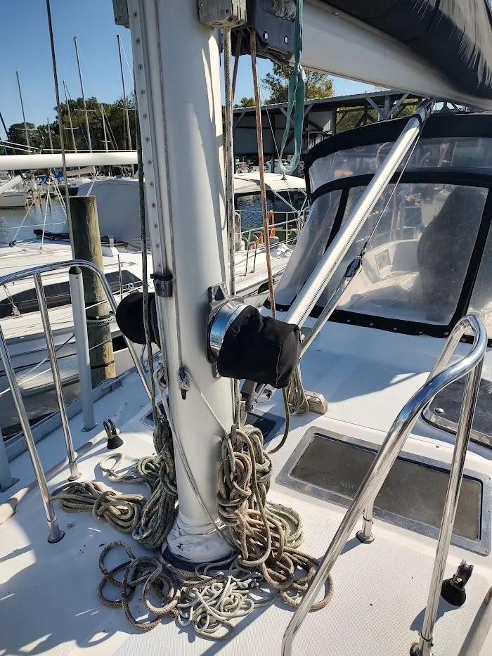 Slide: The Image of Sailboat deck of 1997 Hylas 46 with ropes and mast, docked at marina. - 14
