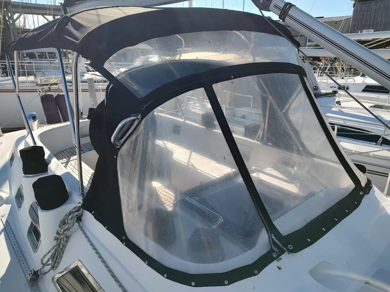 Slide: The Image of Hylas 46 sailboat cockpit with protective canopy, 1997 model, docked at marina. - 17