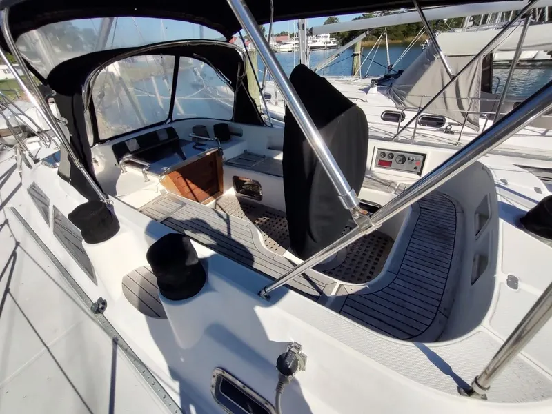 Slide: The Image of Sailboat cockpit of a 1997 Hylas 46, featuring a covered helm and seating area. - 18