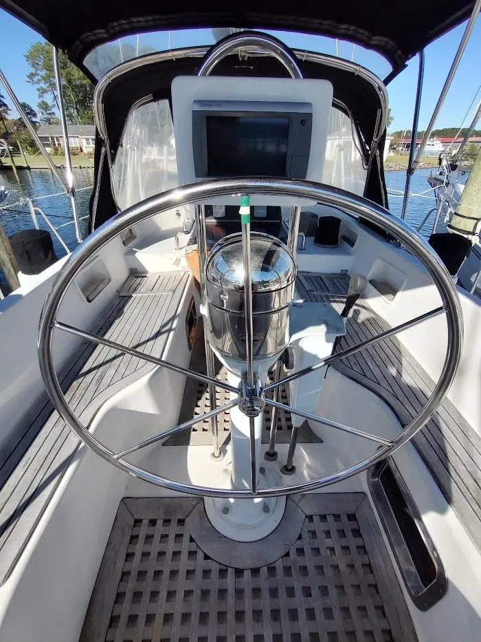 Slide: The Image of Steering wheel of a 1997 Hylas 46 sailboat, featuring a modern cockpit design. - 20