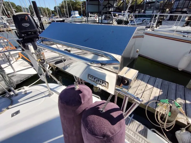 Slide: The Image of Stainless steel Magma grill on a 1997 Hylas 46 sailboat at a marina. - 24