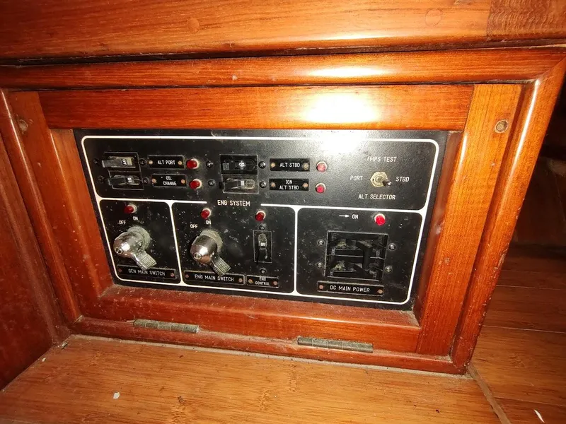 Slide: The Image of Control panel of a 1997 Hylas 46 yacht with switches and indicators. - 35