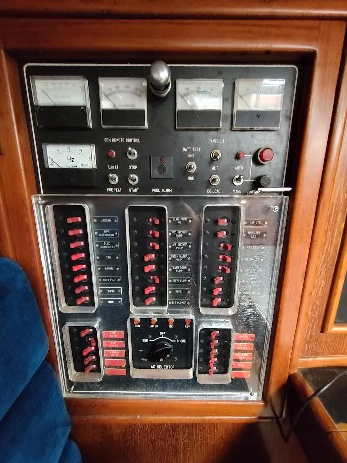 Slide: The Image of Control panel of a 1997 Hylas 46 yacht with switches and gauges. - 36