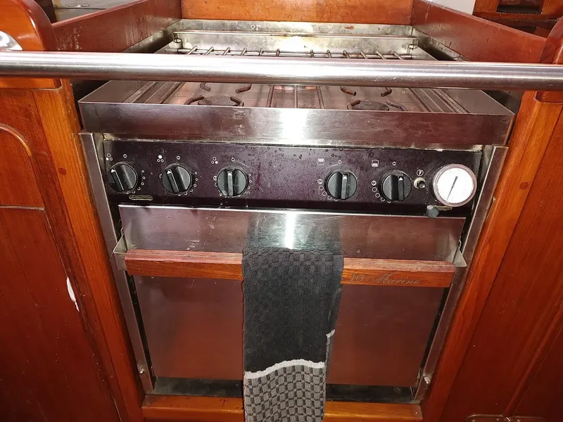 Slide: The Image of Stainless steel marine stove with control knobs on a 1997 Hylas 46 yacht. - 46
