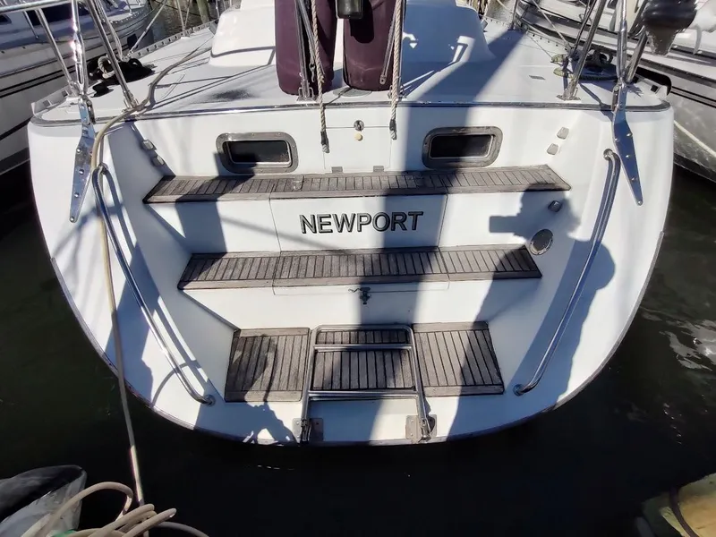 Slide: The Image of Stern view of 1997 Hylas 46 sailboat with "Newport" on the transom. - 6