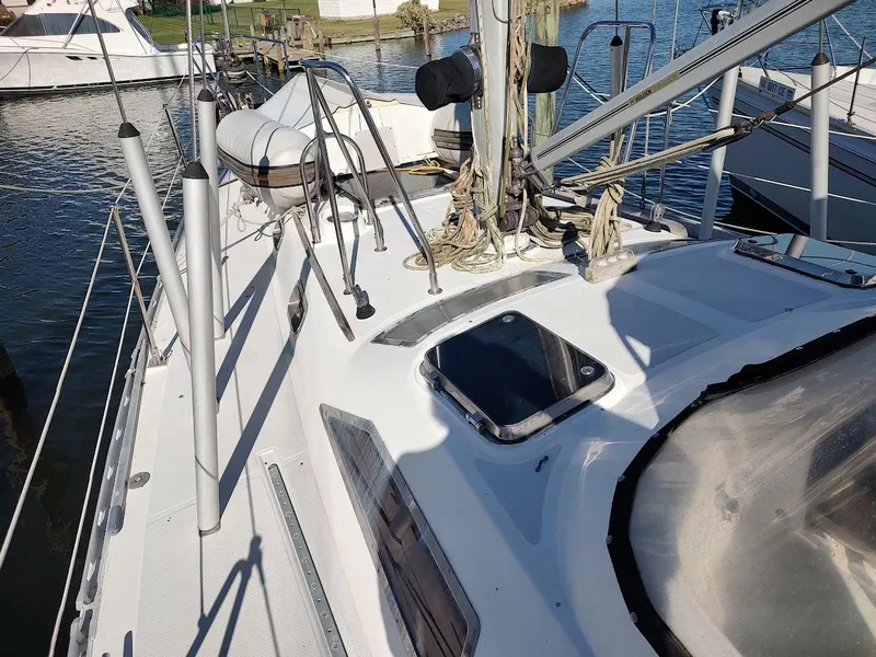Slide: The Image of Deck view of a 1997 Hylas 46 sailboat, featuring rigging and hatches. - 9
