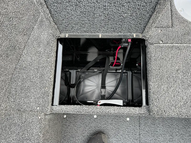 Slide: The Image of Battery compartment of 2025 Lund 1650 Rebel XL SS Blackout boat. - 14