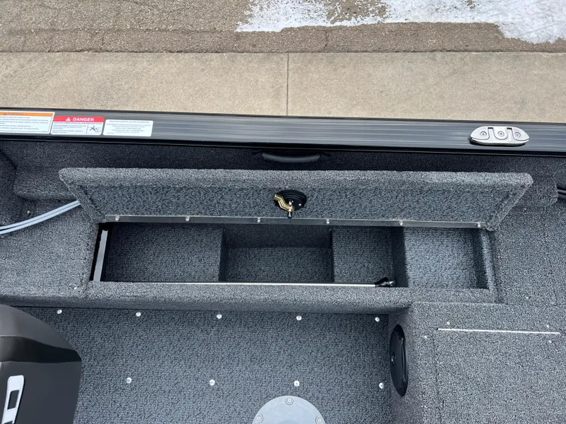 Slide: The Image of 2025 Lund 1650 Rebel XL SS Blackout boat interior storage compartment. - 18