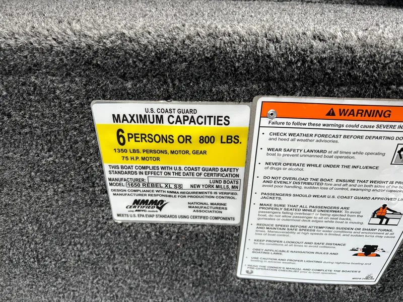 Slide: The Image of 2025 Lund 1650 Rebel XL SS Blackout capacity label, 6 persons or 800 lbs, safety warnings. - 22