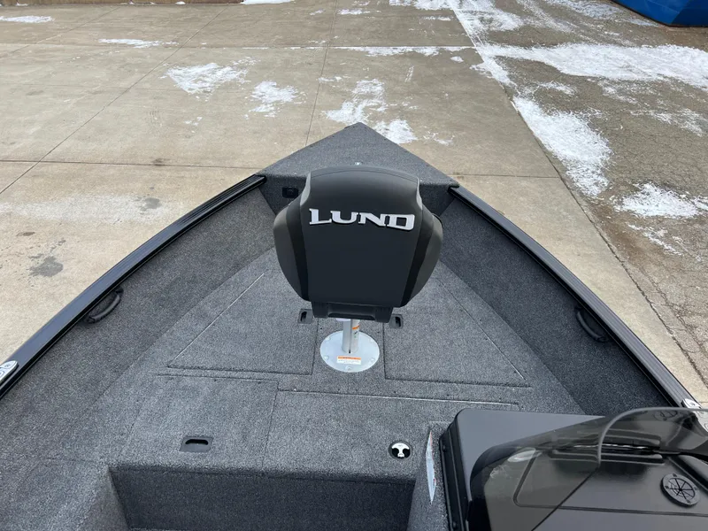 Slide: The Image of 2025 Lund 1650 Rebel XL SS Blackout boat interior with seating and deck view. - 9