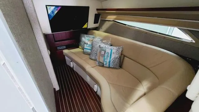 Slide: The Image of Luxurious interior of 2022 Cobalt R35 boat with plush seating and modern TV. - 11