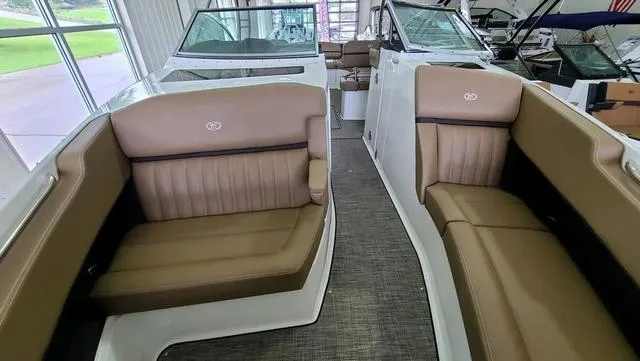 Slide: The Image of 2022 Cobalt R35 boat interior with tan leather seating and modern design. - 12