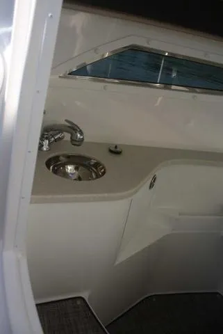 Slide: The Image of Interior of 2022 Cobalt R35 boat featuring a sleek sink and countertop. - 13