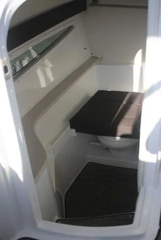 Slide: The Image of Interior cabin of 2022 Cobalt R35 boat with seating and window. - 14