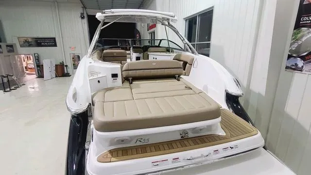 Slide: The Image of 2022 Cobalt R35 boat with spacious seating in a showroom. - 4