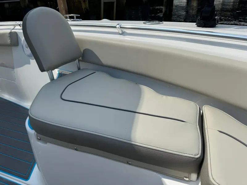 Slide: The Image of 2024 Key West 239 FS boat seat with gray upholstery and sleek design. - 12