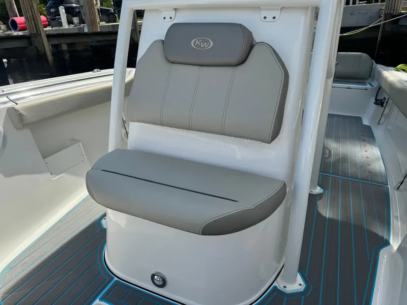 Slide: The Image of 2024 Key West 239 FS boat seat with gray upholstery and sleek design. - 14