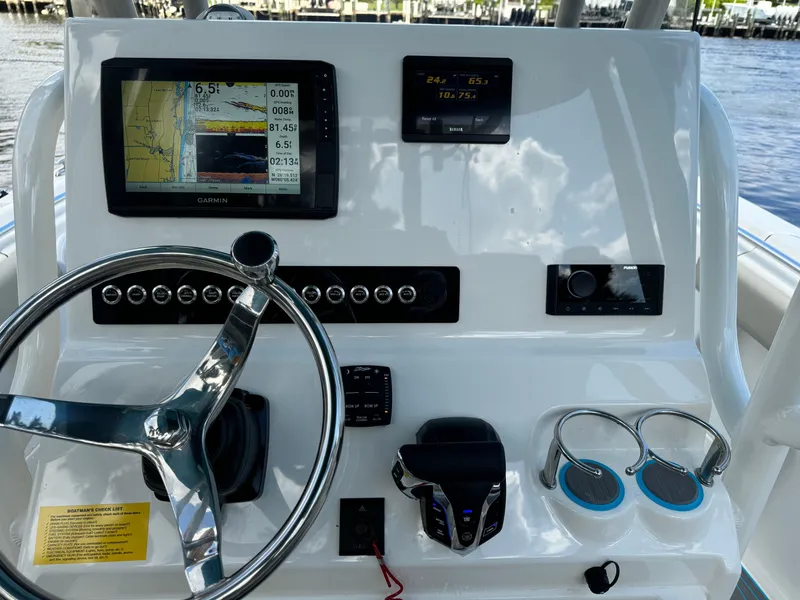 Slide: The Image of 2024 Key West 239 FS boat dashboard with navigation system and controls. - 18