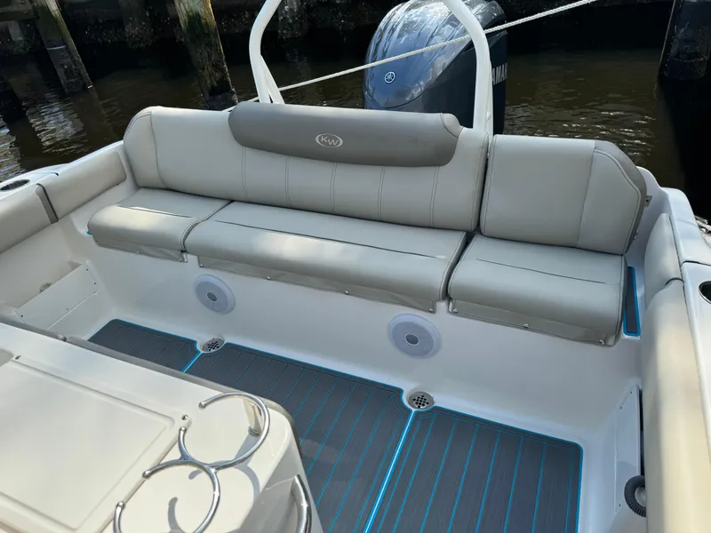 Slide: The Image of 2024 Key West 239 FS boat interior with cushioned seating and modern design. - 24
