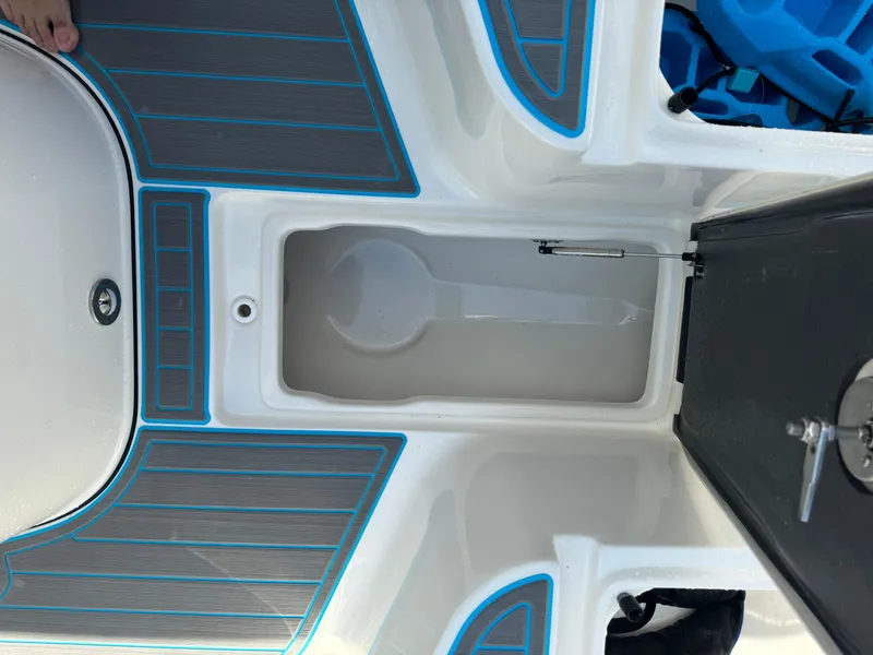 Slide: The Image of 2024 Key West 239 FS boat interior with storage compartment and non-slip flooring. - 29