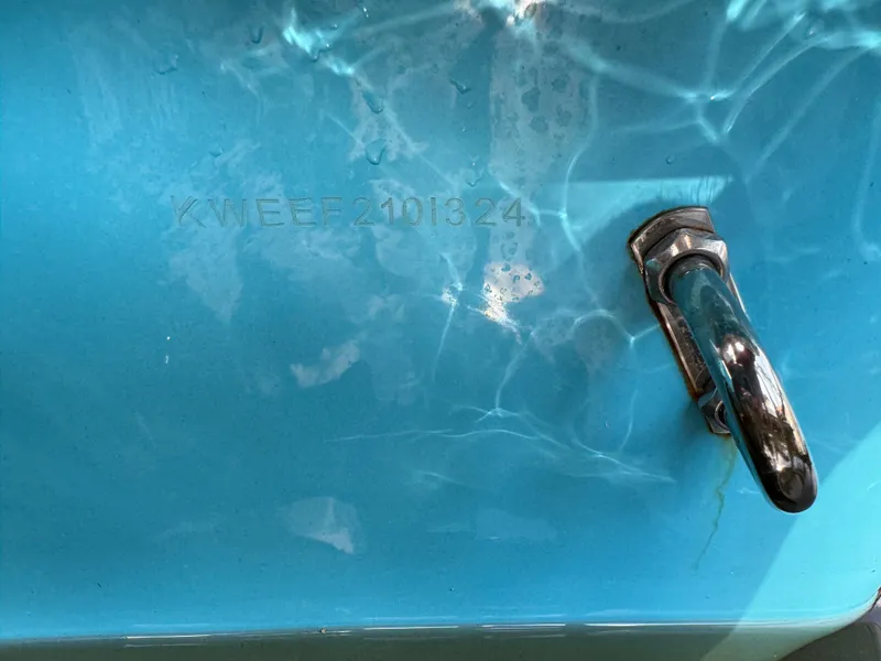 Slide: The Image of Close-up of 2024 Key West 239 FS boat hull with serial number and metal fitting. - 32