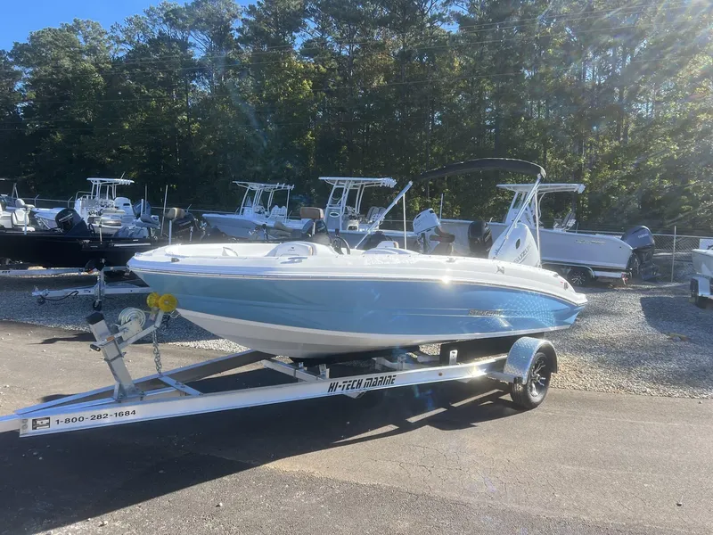 Slide: The Image of 2025 Stingray SC 182SC boat on trailer in sunny outdoor setting. - 1