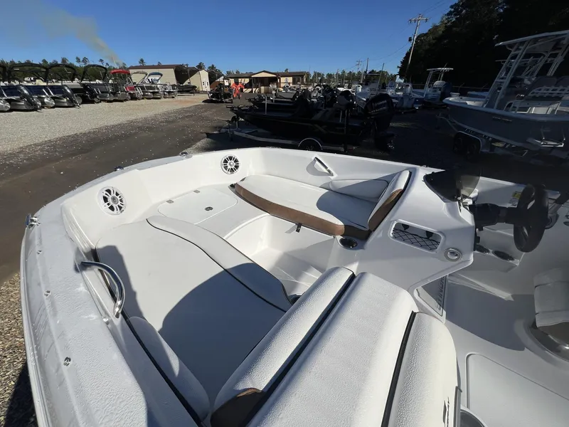 Slide: The Image of 2025 Stingray SC 182SC boat interior with white seating and modern dashboard. - 3
