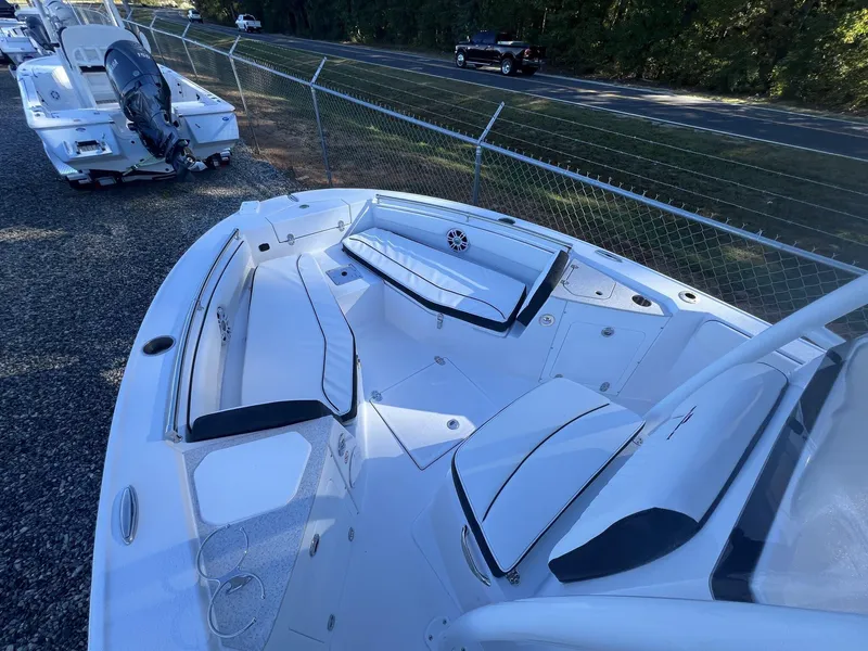 Slide: The Image of 2025 Stingray CC 216 CC boat interior with white seating and modern design. - 13