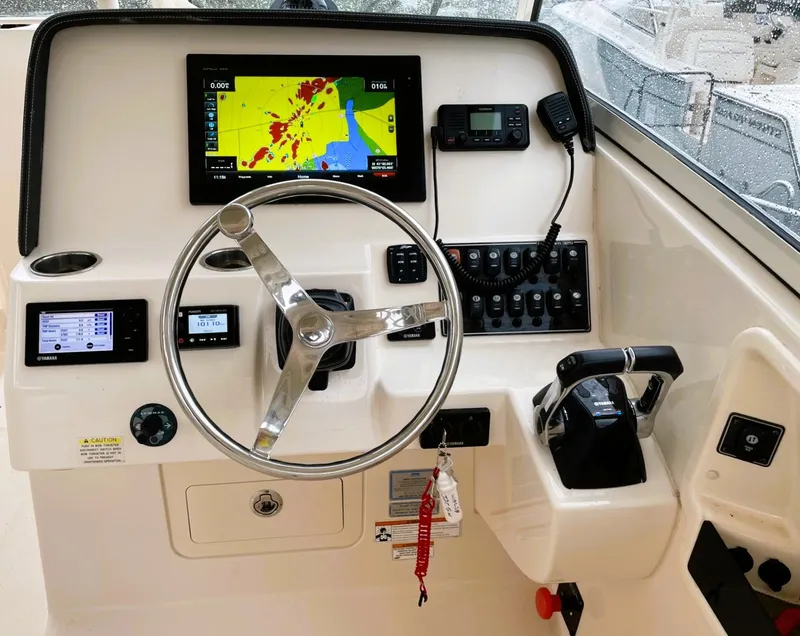 Slide: The Image of Grady-White Freedom 325 helm with navigation display and controls, 2018 model. - 10