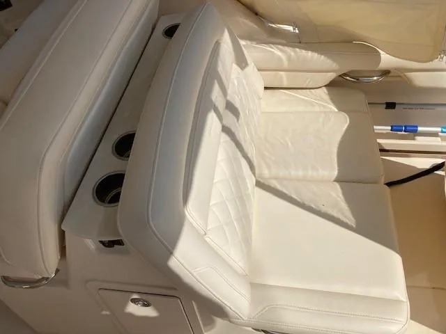 Slide: The Image of Luxurious seating on 2018 Grady-White Freedom 325 boat with white upholstery. - 11