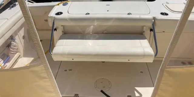 Slide: The Image of 2018 Grady-White Freedom 325 boat interior with foldable seating. - 12