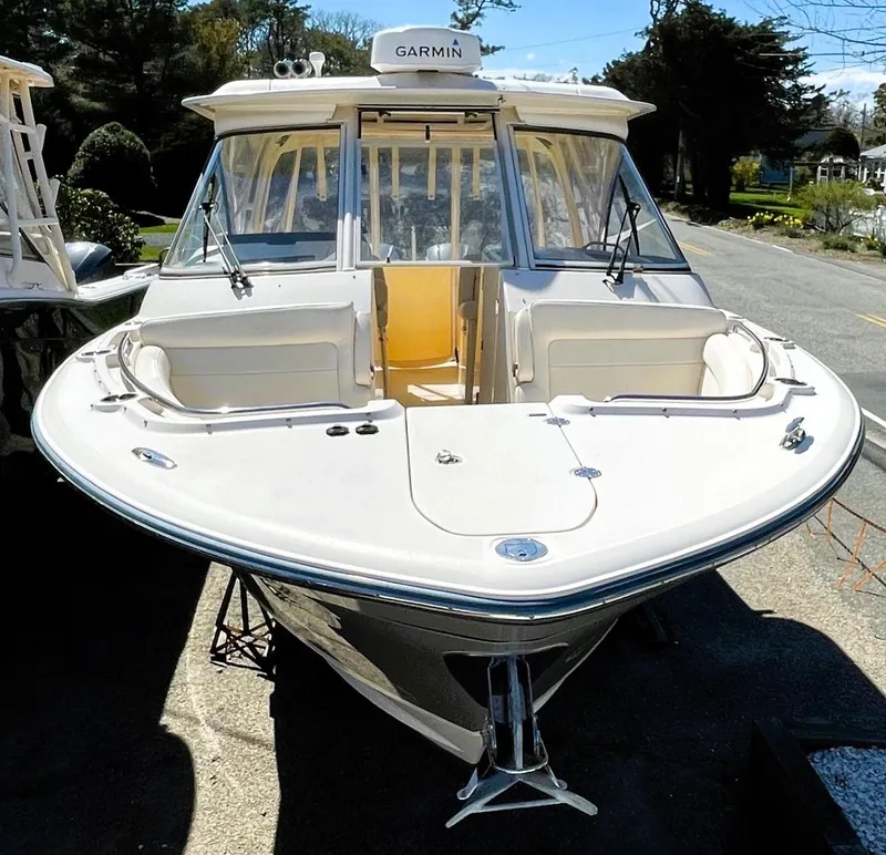 Slide: The Image of 2018 Grady-White Freedom 325 boat with Garmin equipment, docked outdoors. - 5
