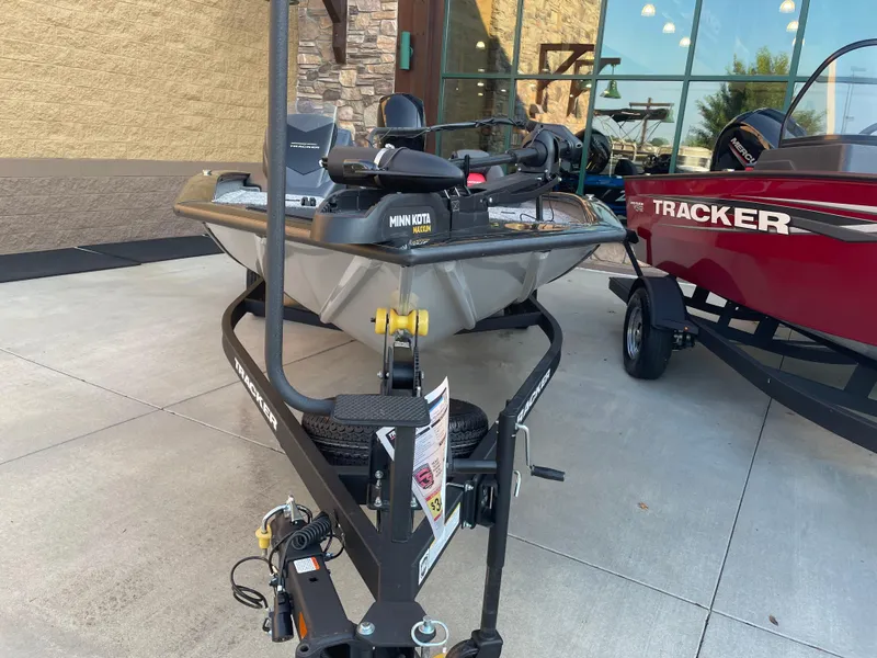 Slide: The Image of 2025 Tracker Pro Team 195 Tournament Edition boat on trailer, featuring Minn Kota Maxxum motor. - 2